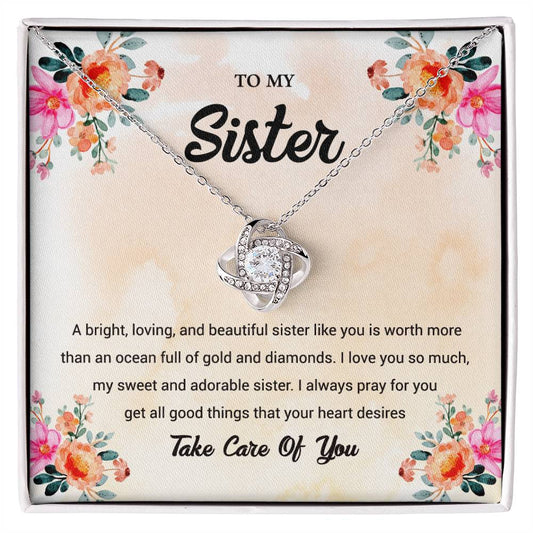 TO MY Sister A bright, loving, and beautiful sister like you is worth_ Love Knot Necklace